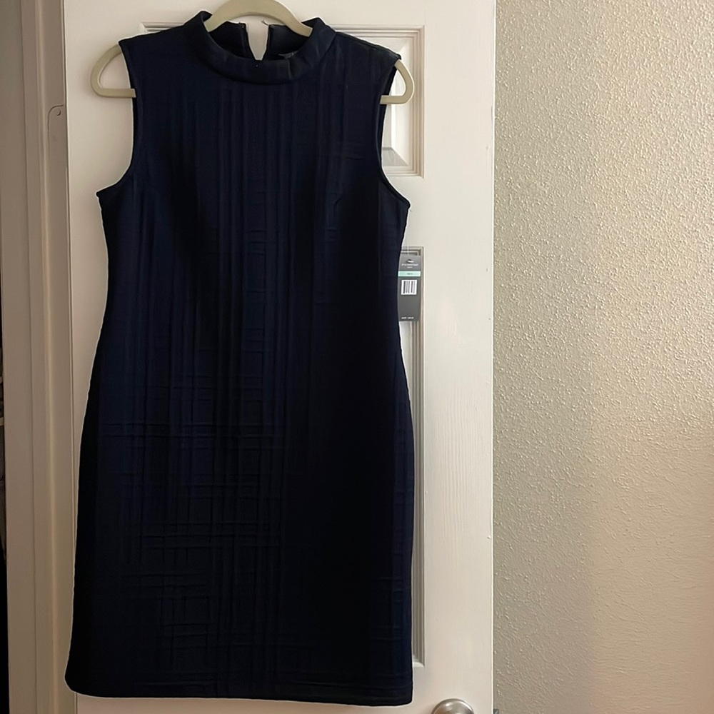 Navy blue dress with high neck. New with tag. Size 8.